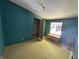 Bedroom with blue walls, a window for natural light, and a personal closet for storage at 3587 Lower Patton Park Rd, Martinsville, IN 46151