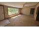 Bright living room filled with natural light featuring a ceiling fan and a front facing window at 3587 Lower Patton Park Rd, Martinsville, IN 46151