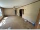 Open living room with ceiling fan and multiple entryways, ready for personalized updates at 3587 Lower Patton Park Rd, Martinsville, IN 46151