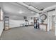 Spacious basement with carpeting, painted walls, shelving, and a variety of furniture at 3624 Woodcliff Dr, Indianapolis, IN 46203