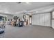 Open basement featuring carpeted floors and ample storage with white sliding doors at 3624 Woodcliff Dr, Indianapolis, IN 46203