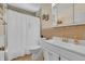 Bathroom featuring a shower with a white curtain, a toilet and a sink at 3624 Woodcliff Dr, Indianapolis, IN 46203