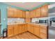 Well-organized kitchen featuring wooden cabinets, stainless steel appliances and lots of counter space at 3624 Woodcliff Dr, Indianapolis, IN 46203
