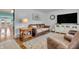 Cozy living room with leather furniture, hardwood floors, and a neutral color scheme at 3624 Woodcliff Dr, Indianapolis, IN 46203
