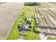 Stunning aerial view of estate showcasing manicured grounds, a winding driveway, and expansive farmland at 3840 W 38Th St, Anderson, IN 46011