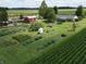 Expansive property with garden, barn, and charming home in a serene, rural setting with lush landscape at 3840 W 38Th St, Anderson, IN 46011
