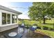 Inviting back patio with outdoor seating overlooking a spacious, well-maintained lawn at 3840 W 38Th St, Anderson, IN 46011