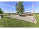 Sand lot in backyard with string lights, fire pit, and an outdoor lounge area at 3840 W 38Th St, Anderson, IN 46011
