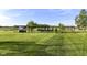 Expansive backyard featuring mature trees and a pergola at 3840 W 38Th St, Anderson, IN 46011