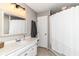 Bathroom with a vanity, mirror, updated lighting and a bathtub with shower at 3840 W 38Th St, Anderson, IN 46011