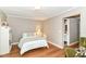 Cozy bedroom featuring hardwood floors, soft lighting, and a comfortable bed for a restful night's sleep at 3840 W 38Th St, Anderson, IN 46011