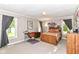 Spacious bedroom with an study area, carpeted floors, and ample natural light from multiple windows at 3840 W 38Th St, Anderson, IN 46011
