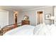 Bedroom featuring hardwood floors, a comfortable bed, and multiple doorways to other rooms at 3840 W 38Th St, Anderson, IN 46011