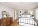 Charming bedroom with a decorative mirror, bedside tables, and lots of natural light at 3840 W 38Th St, Anderson, IN 46011
