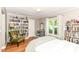 Bright bedroom with bookshelves and a comfortable chair, perfect for relaxing and reading at 3840 W 38Th St, Anderson, IN 46011