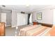 Well-lit bedroom with large windows, spacious closet, and a comfortable desk space at 3840 W 38Th St, Anderson, IN 46011