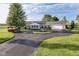 Charming home with a well-manicured lawn and circular driveway, offering comfort and curb appeal at 3840 W 38Th St, Anderson, IN 46011