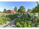 Lush garden with raised beds and gravel pathways, promoting sustainable living and fresh produce at 3840 W 38Th St, Anderson, IN 46011