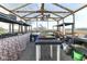 The greenhouse interior showcases shelving for plants and gardening, creating an ideal growing environment at 3840 W 38Th St, Anderson, IN 46011