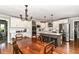 Spacious kitchen and dining room combo features an island, white cabinets, and hardwood floors at 3840 W 38Th St, Anderson, IN 46011