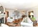 Bright living room features a fireplace, hardwood floors, neutral paint, and a picture gallery at 3840 W 38Th St, Anderson, IN 46011
