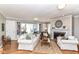 Inviting living room with a fireplace, built-in bookshelves, and natural light, perfect for relaxation at 3840 W 38Th St, Anderson, IN 46011