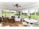 Cozy sun room with ample natural light, comfortable seating, and a view of the surrounding greenery at 3840 W 38Th St, Anderson, IN 46011