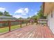 Spacious wooden deck with railing overlooks the backyard and shed at 3898 S Randolph St, Indianapolis, IN 46227