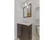 Bathroom features a dark vanity with granite countertops, and a large mirror at 3898 S Randolph St, Indianapolis, IN 46227