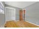 Empty bedroom features a closet, laminate flooring and neutral paint at 3898 S Randolph St, Indianapolis, IN 46227