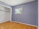 Bedroom with laminate flooring features a closet and window for natural light at 3898 S Randolph St, Indianapolis, IN 46227