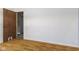 Bedroom with laminate flooring, light walls, and door to another room at 3898 S Randolph St, Indianapolis, IN 46227