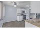 Modern kitchen with sleek stainless steel appliances, white cabinets, and stylish backsplash at 3898 S Randolph St, Indianapolis, IN 46227