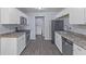 Well-equipped kitchen featuring stainless steel appliances, light countertops, and ample cabinet space at 3898 S Randolph St, Indianapolis, IN 46227