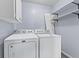 Laundry room with washer and dryer and open shelving for storage at 3898 S Randolph St, Indianapolis, IN 46227