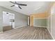 Open-concept living room flows into the kitchen, featuring modern gray flooring and natural light at 3898 S Randolph St, Indianapolis, IN 46227