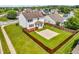 Aerial view of the backyard with a wooden deck, basketball court, and privacy fence at 4157 Taunton Ct, Plainfield, IN 46168