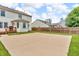 Backyard showcasing a basketball court, wooden deck, and well-kept lawn at 4157 Taunton Ct, Plainfield, IN 46168