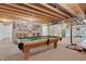 Finished basement with a pool table and walls decorated with memorabilia at 4157 Taunton Ct, Plainfield, IN 46168