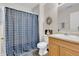 Bathroom with shower/tub combination and wooden vanity, plus natural colored walls at 4157 Taunton Ct, Plainfield, IN 46168
