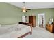 Spacious bedroom featuring a ceiling fan, and a cozy ambiance with plush carpet flooring at 4157 Taunton Ct, Plainfield, IN 46168