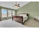 Bright bedroom with large windows, ceiling fan, and plush carpeting at 4157 Taunton Ct, Plainfield, IN 46168