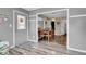 Welcoming entryway with grey door, convenient coat hooks, and a view into the dining area at 4157 Taunton Ct, Plainfield, IN 46168