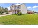 Attractive two-story home featuring a well-manicured lawn, attached garage, and inviting front porch at 4157 Taunton Ct, Plainfield, IN 46168