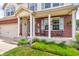 Charming front porch with brick siding, decorative columns, and space for seating at 4157 Taunton Ct, Plainfield, IN 46168