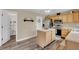 Open kitchen with island, stainless appliances, and view to other rooms at 4157 Taunton Ct, Plainfield, IN 46168