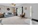 Inviting living room features patterned wallpaper and a comfortable blue sofa at 4157 Taunton Ct, Plainfield, IN 46168