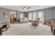 Open concept living room leading to kitchen features neutral colors and carpeted floors at 4157 Taunton Ct, Plainfield, IN 46168