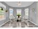 Cozy sitting area with natural light and white wicker chairs, perfect for relaxing at 4157 Taunton Ct, Plainfield, IN 46168