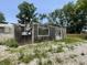 Unique exterior showing exposed structure offering a renovation opportunity with new windows ready for design at 4566 Melbourne Rd, Indianapolis, IN 46228
